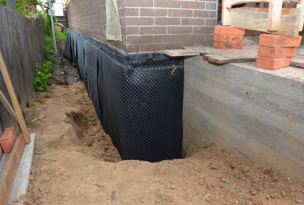 Happy homeowners after waterproofing job in Point Pleasant